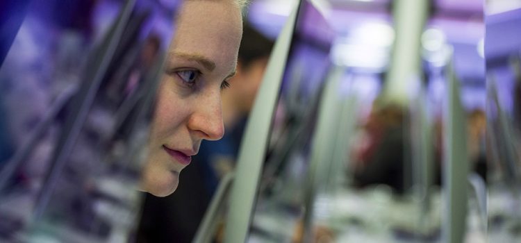 Portrait of a student working on an iMac